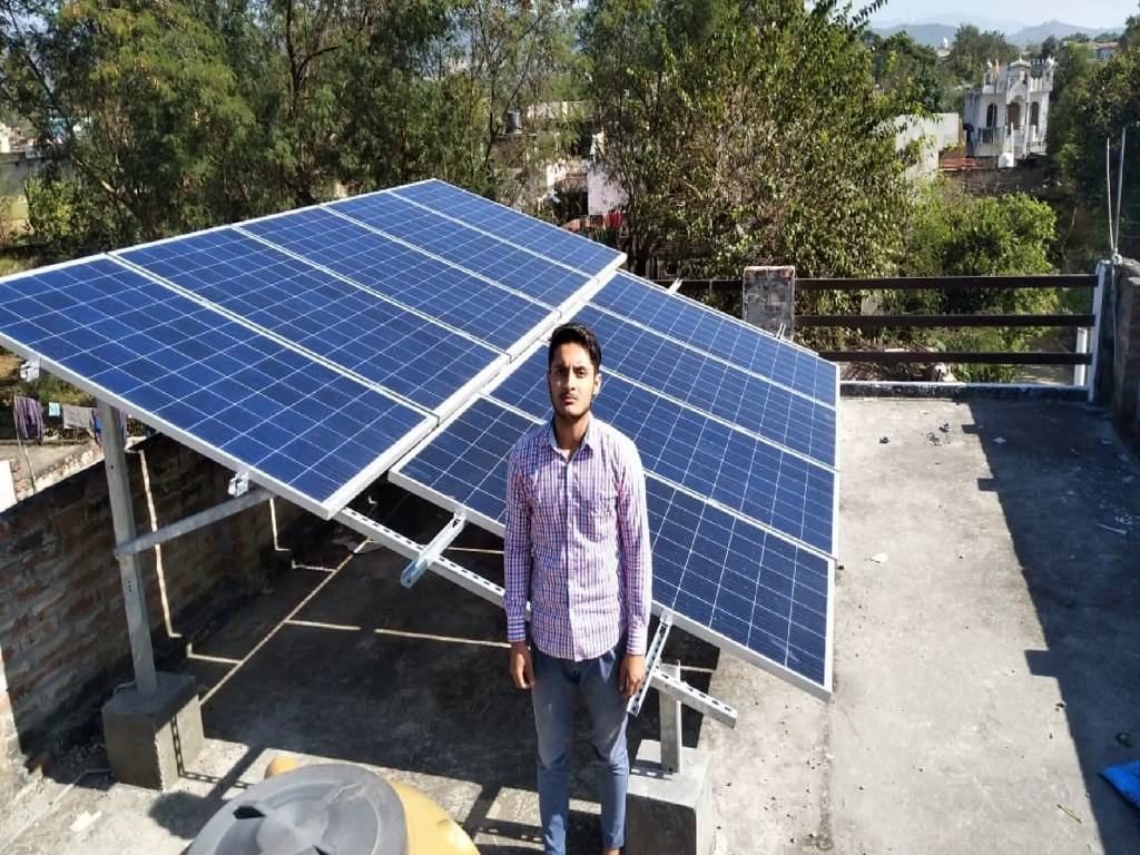 Maurice Solar engineer at a completed rooftop installation in Himachal Pradesh