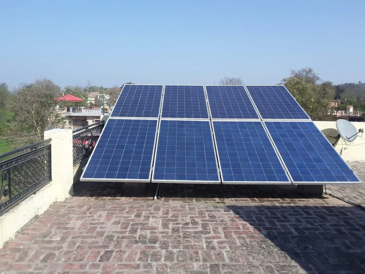 Large rooftop solar array against a red brick building