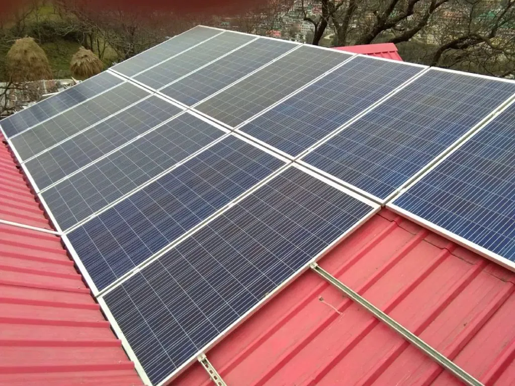 Rooftop solar on a red-roofed hillside home